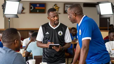 Marumo Gallants FC coach Abdeslam Ouaddou shares football knowledge with Lesotho national team coach Bob Mafoso in a...